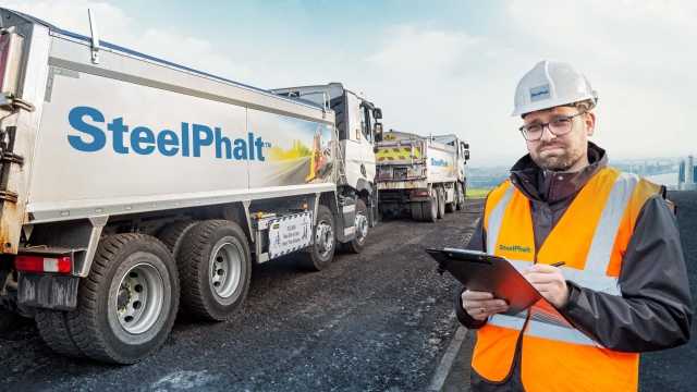 SteelPhalt team member and truck