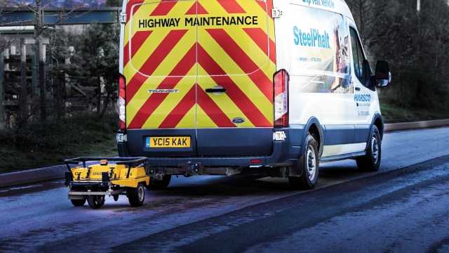 SteelPhalt truck laying pavement