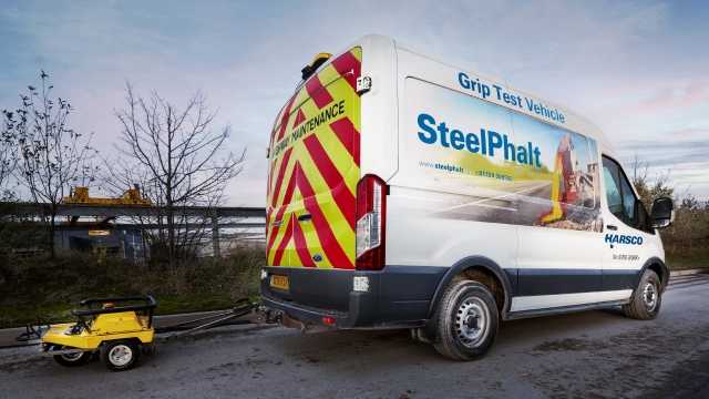 SteelPhalt truck laying pavement