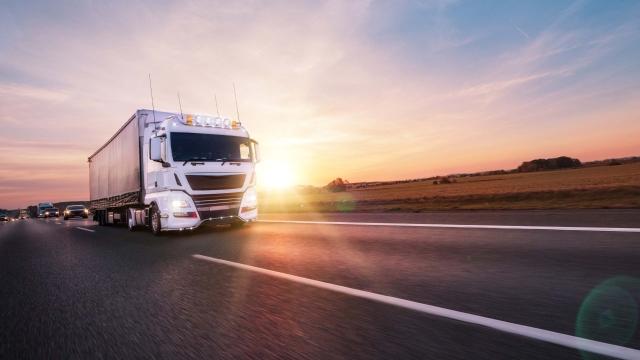 truck driving at sunset