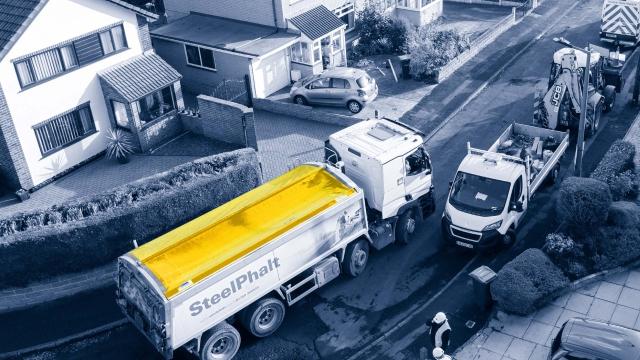 SteelPhalt truck on narrow road