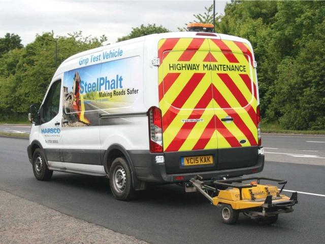 SteelPhalt truck laying pavement