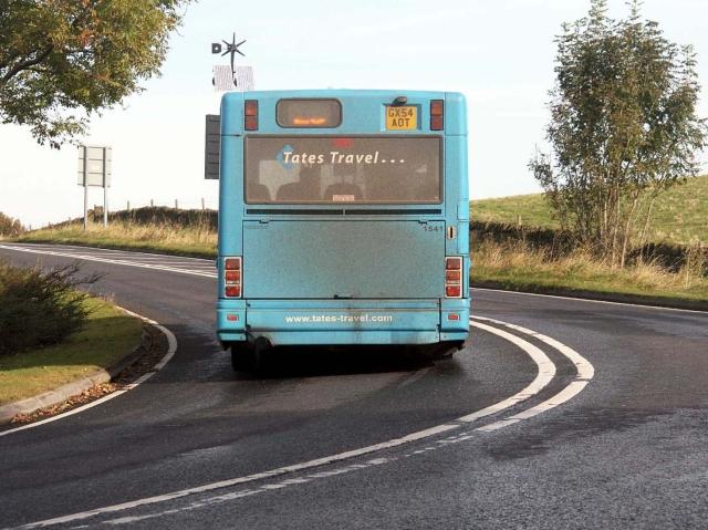 bus driving on asphalt road