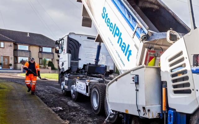 SteelPhalt truck laying pavement